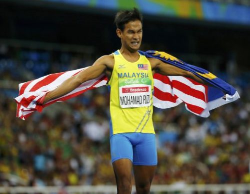 2016 Rio Paralympics - Men's 100m - T36 Final - Olympic Stadium - Rio de Janeiro, Brazil - 10/09/2016.  Mohamad Ridzuan Mohamad Puzi of Malaysia celebrates after winning the gold medal in the event.   REUTERS/Ricardo Moraes   FOR EDITORIAL USE ONLY. NOT FOR SALE FOR MARKETING OR ADVERTISING CAMPAIGNS.