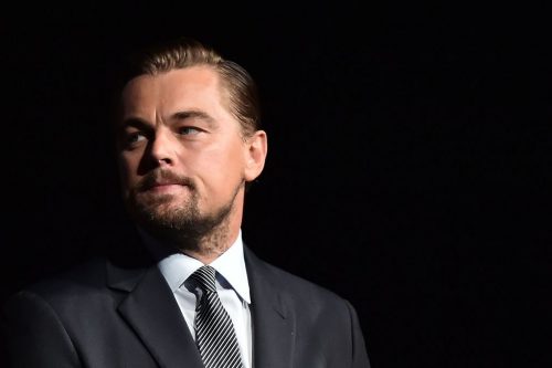 US actor Leonardo DiCaprio looks on prior to speaking on stage during the Paris premiere of the documentary film "Before the Flood" on October 17, 2016 at the Theatre du Chatelet in Paris. US actor Leonardo DiCaprio has issued an impassioned call for immediate action on climate change in "Before the Flood", a documentary film making its premiere in Paris on October 17. DiCaprio takes viewers around the world to meet experts and politicians in order to reveal the scale of the problem, its effects and the paths towards solutions. / AFP / POOL / CHRISTOPHE ARCHAMBAULT (Photo credit should read CHRISTOPHE ARCHAMBAULT/AFP/Getty Images)