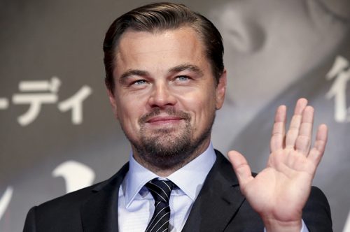 Oscar-winning actor Leonardo DiCaprio waves as he attends the Japan premiere of his movie "The Revenant" in Tokyo, Japan, March 23, 2016. REUTERS/Toru Hanai - RTSBUPU