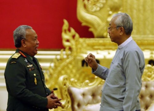 Malaysia's Army Commander Senior Gen, Zulkifeli Mohd. Zin, left, speaks with Myanmar's President Htin Kyaw during their meeting at the President House in Naypyitaw, Myanmar Monday, Dec. 5, 2016. (AP Photo/Aung Shine Oo)