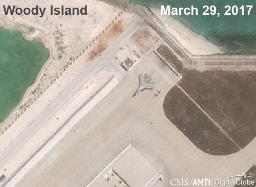 A Chinese J-11 fighter jet is pictured on the airstrip at Woody Island in the South China Sea in this March 29, 2017 handout satellite photo.   CSIS Asia Maritime Transparency Initiative/DigitalGlobe/Handout via REUTERS